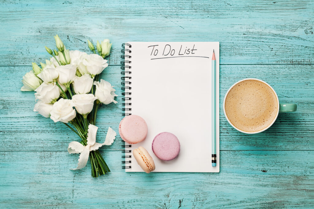 spring checklist, with flowers and mug of coffee